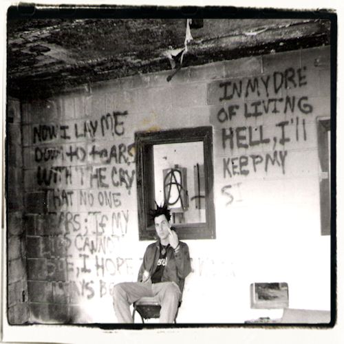 George on a chair with bomb